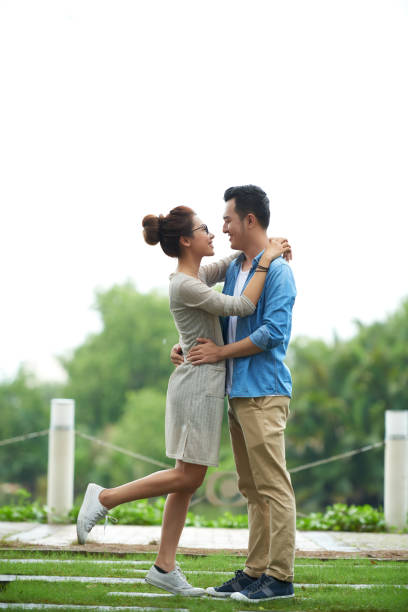 istock Carefree Asian Couple Embracing on Date 700100334