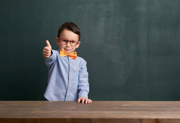 istock Child is in front of chalkboard 700100712
