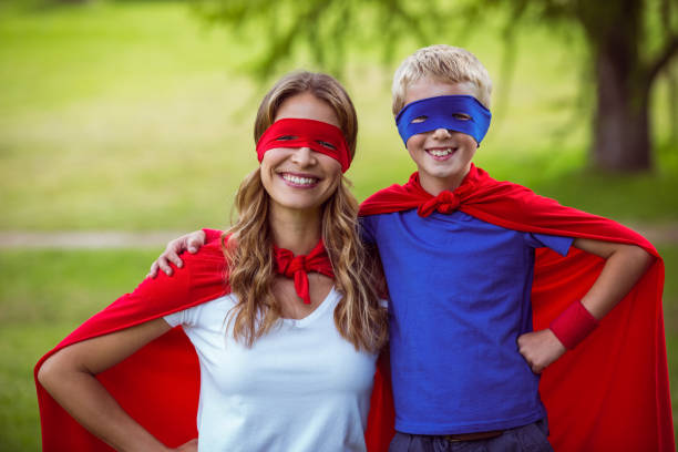 istock Mother and son pretending to be superhero 700109992