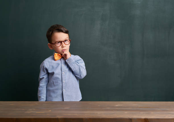 istock Child is in front of chalkboard 700110640