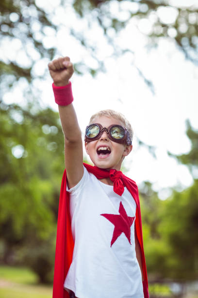 istock Little boy pretending to be superhero 700110700