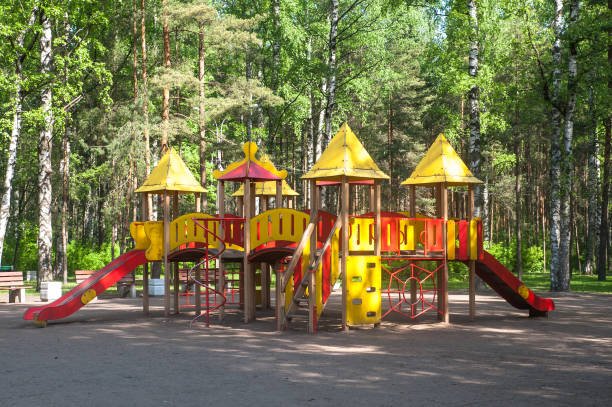 istock Empty children's playground in the summer park 700112848