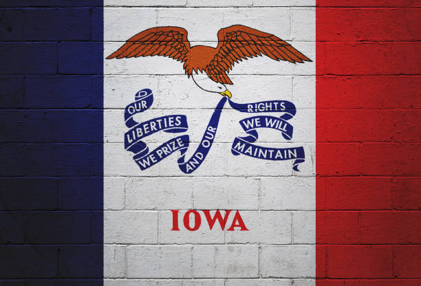 Iowa state flag painted on a wall Flag of Iowa painted on a brick wall. iowa flag stock pictures, royalty-free photos & images