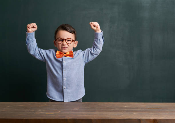 istock Strong child is in front of chalkboard 700126188
