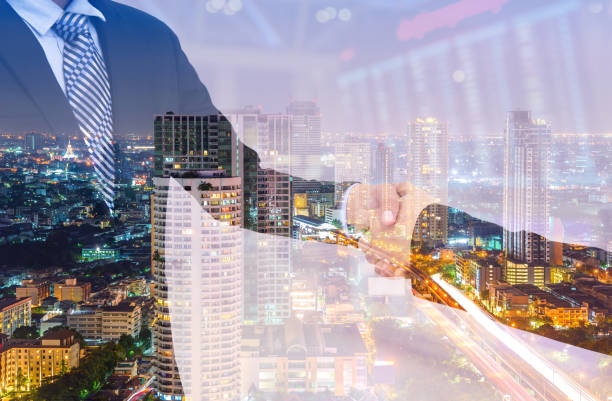 istock business handshake with city background, Double exposure style 700126428