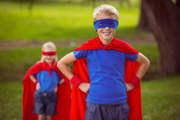 istock Brother and sister pretending to be superhero 700128596