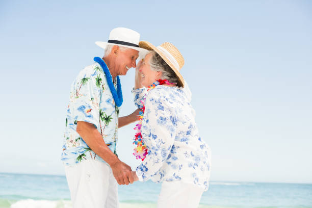 istock Senior couple looking at each other on the beach 700134550