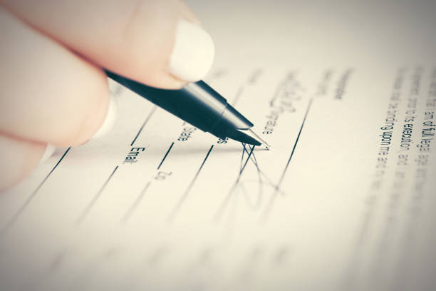 Business woman signing contract