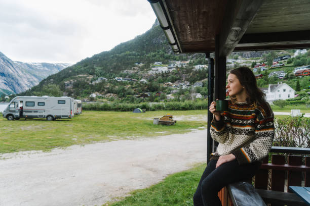 istock Woman drinking tea in campingin Norway 700165012