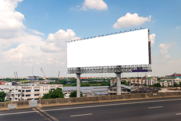 istock billboard ready for new advertisement on road with city background 700165210