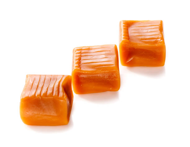 istock three toffee caramel candies isolated on white background 700168638