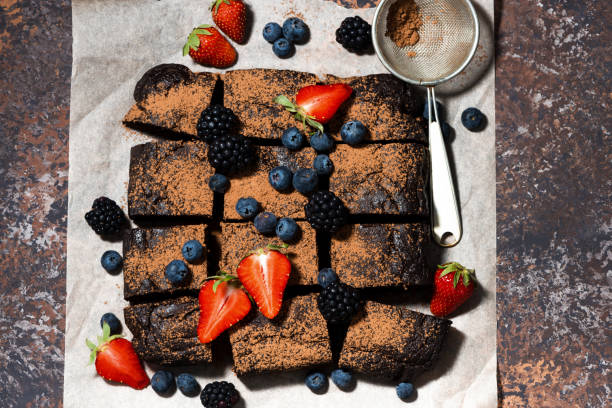 istock dessert - chocolate brownies with fresh berries, top view 700171604