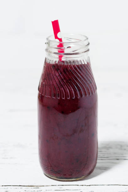 istock healthy berry smoothies on white background, closeup 700180916
