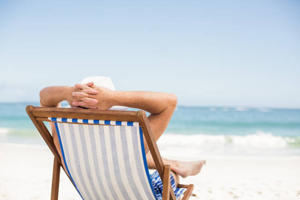 istock Senior man lying in a sunchair 700180996