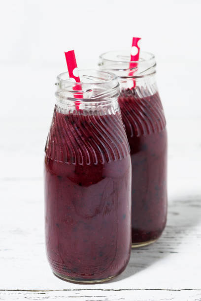 istock healthy berry smoothies on white background 700181262