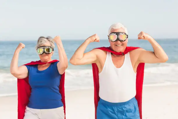Photo of Senior couple wearing superman costume
