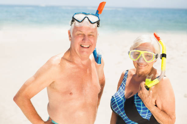 istock Senior couple wearing snorkel and diving goggles 700184378