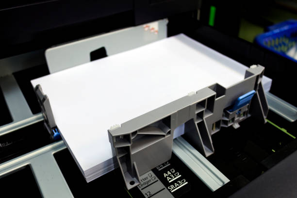 istock paper tray for multifunction printer in office with soft-focus and over light in the background 700184520