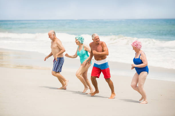 istock Seniors running at the beach 700184810