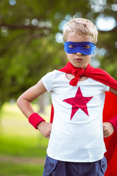 istock Little boy pretending to be superhero 700185126