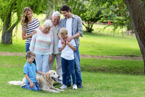 istock Family with dog in the park 700185334