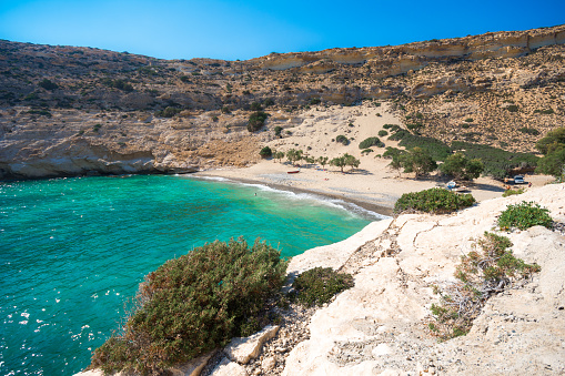 The small isolated gulf of Vathi, in Crete, with sandy beach and some lucky campers.