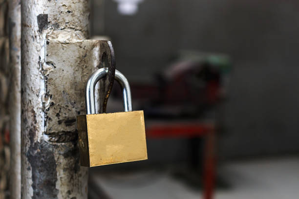 istock closeup old master key and rusty lock with soft-focus and over light 700193504