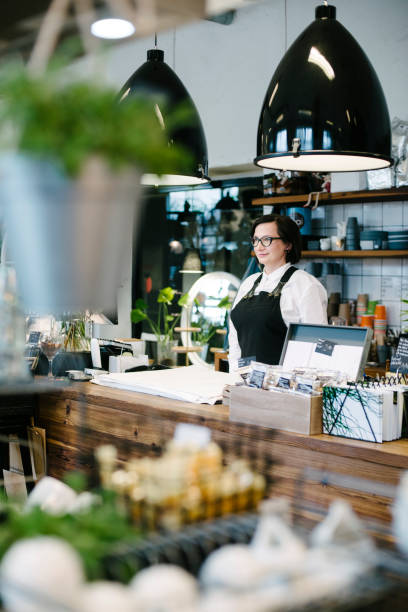 istock Small Business Owner behind Counter 700199244