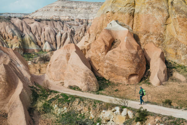istock tourist exploring Cappadocia Red and Rose valleys 700200236