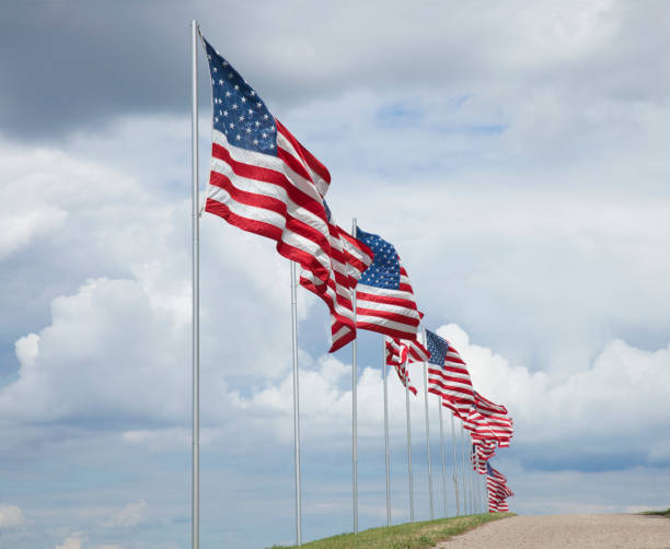 istock American flags waving in the wind 700202910
