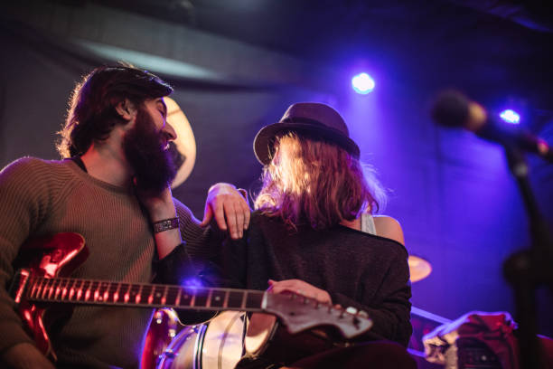 istock Guitarist and his girlfriend 700208536
