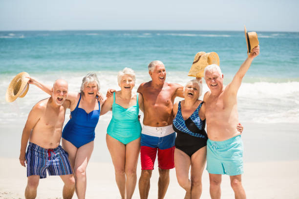 istock Seniors standing on the beach 700212268