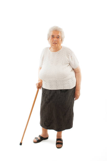 istock Old woman with a cane 700218704