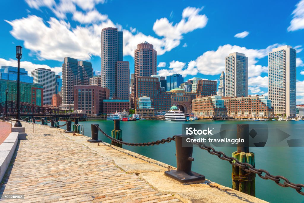 Boston skyline in sunny summer day, view from harbor on downtown, Massachusetts, USA Boston skyline in sunny summer day, view from harbor on downtown, Massachusetts, USA. Boston - Massachusetts Stock Photo