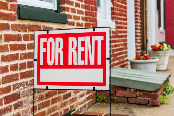 istock Red For Rent sign closeup against brick building 700228842