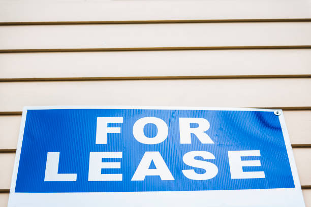 istock Bright blue For Lease sign macro closeup against wall 700231986