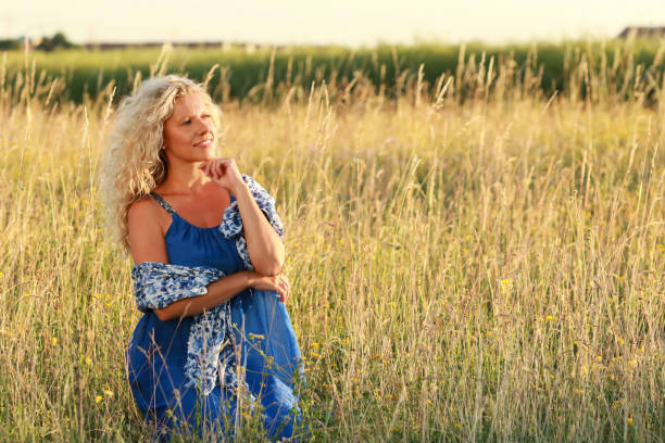 istock attractive mature woman in summer 700234720