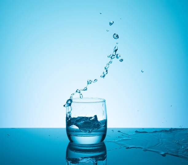 istock Creative splashing water in the glass 700241378