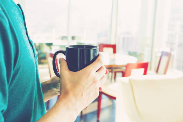 istock Young man with a cup of coffee 700257228