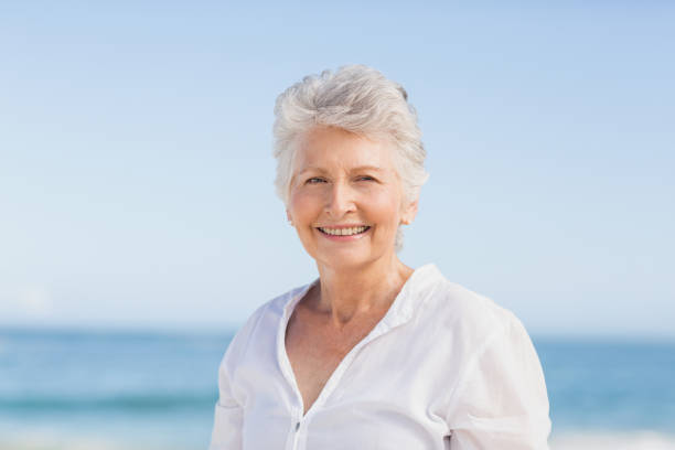 istock Portrait of smiling senior woman 700268308