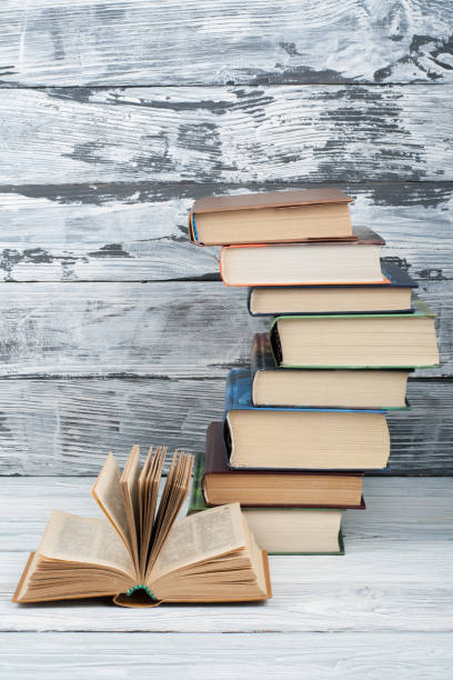 istock Stack of colorful books. Education background. Back to school. Book, hardback colorful books on wooden table. Education business concept. Copy space for text 700268494