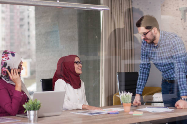 istock Multiethnic group of young business persons at office 700282508