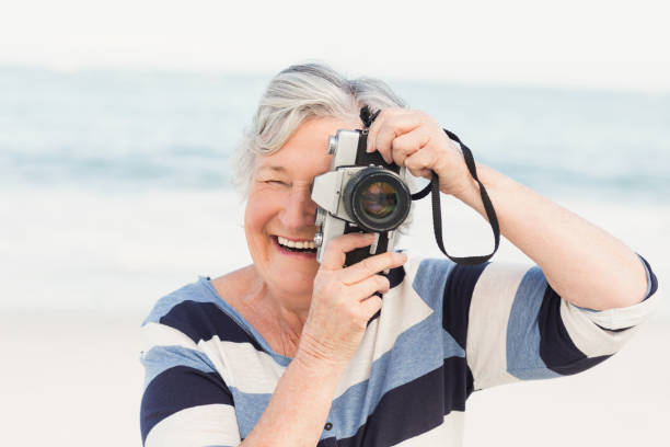 istock Senior woman taking picture 700287586
