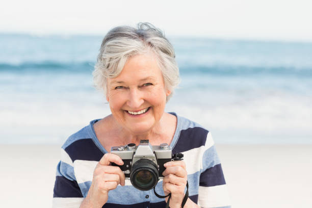 istock Senior woman taking picture 700287596