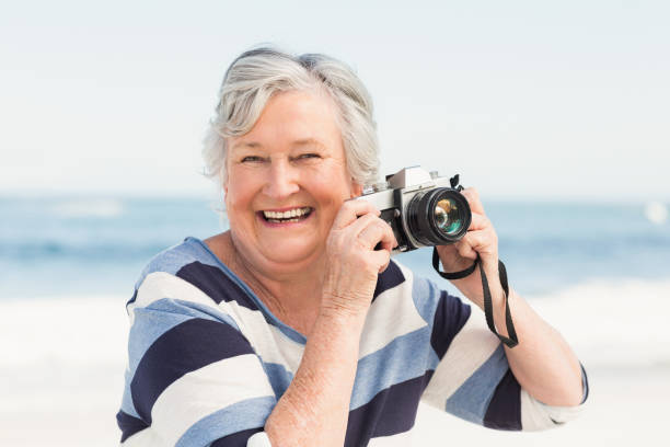 istock Senior woman taking picture 700287616