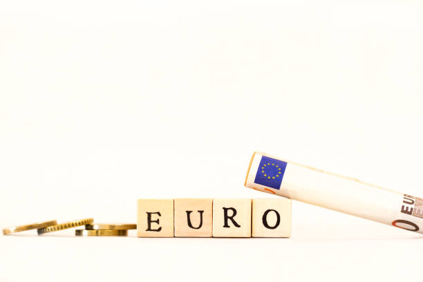 istock EURO: Word Spelled in Wood Blocks; Coins and Bills 700290082