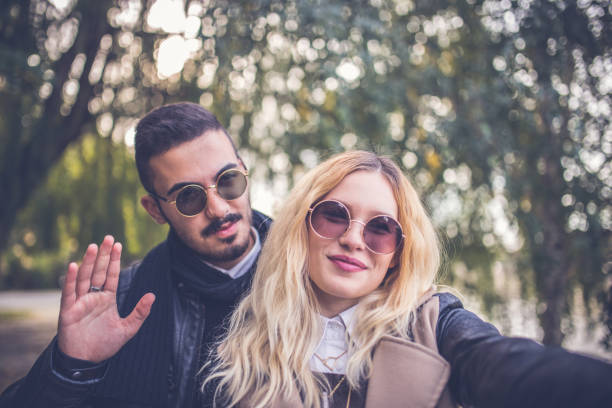 istock Couple relaxing in park 700290116