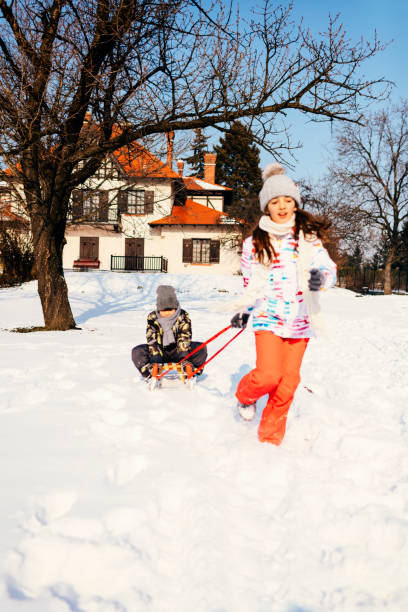 Sledging down the snow hill