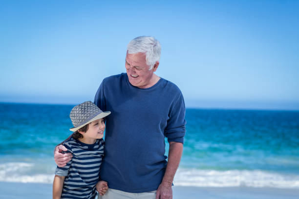 istock Cute boy embracing his grandfather 700297052