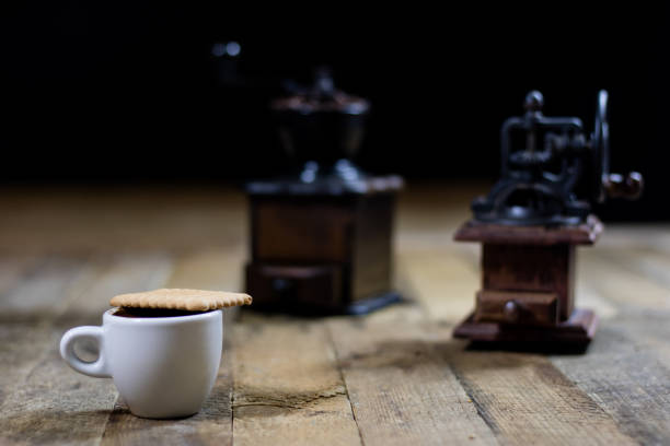 istock Freshly brewed coffee in cups on a wooden table with a milling mill 700303818